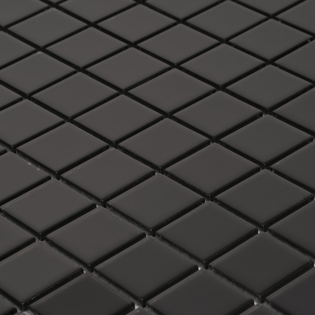 Glossy black glass mosaic tiles in square 1x1 inch pieces arranged in a 12x12 inch sheet