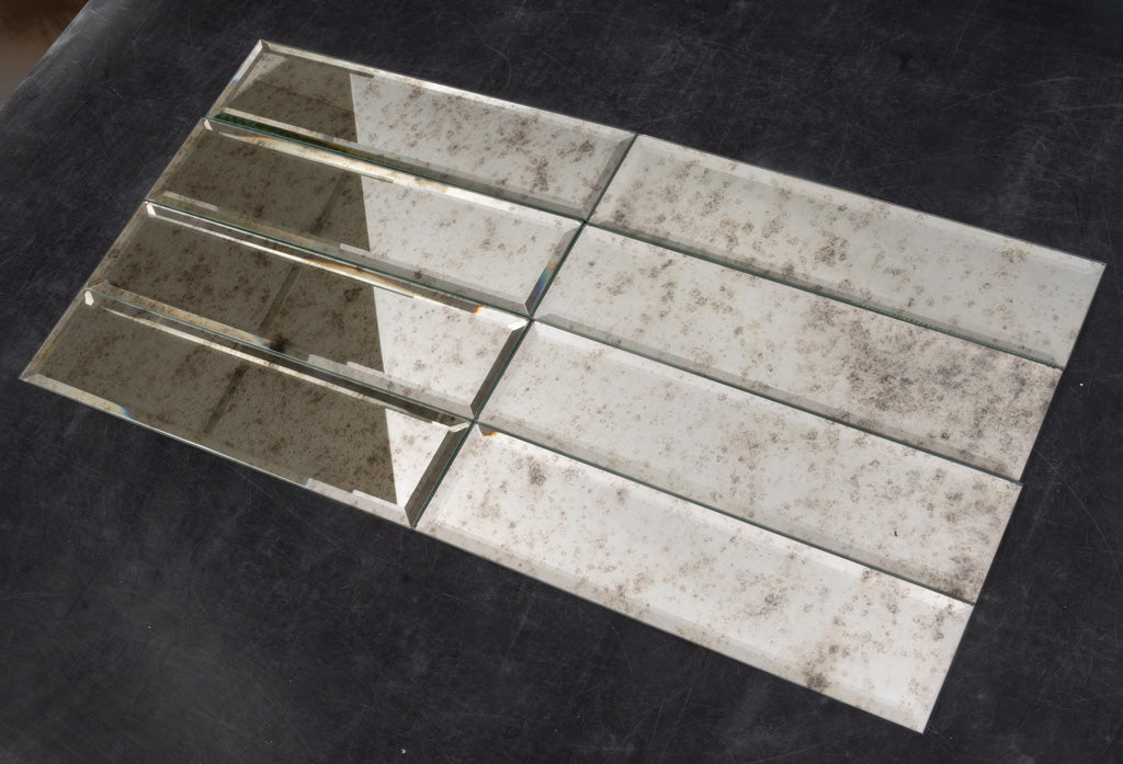 Antique mirror polished glass subway tiles 3x12 with distressed reflective finish laid flat