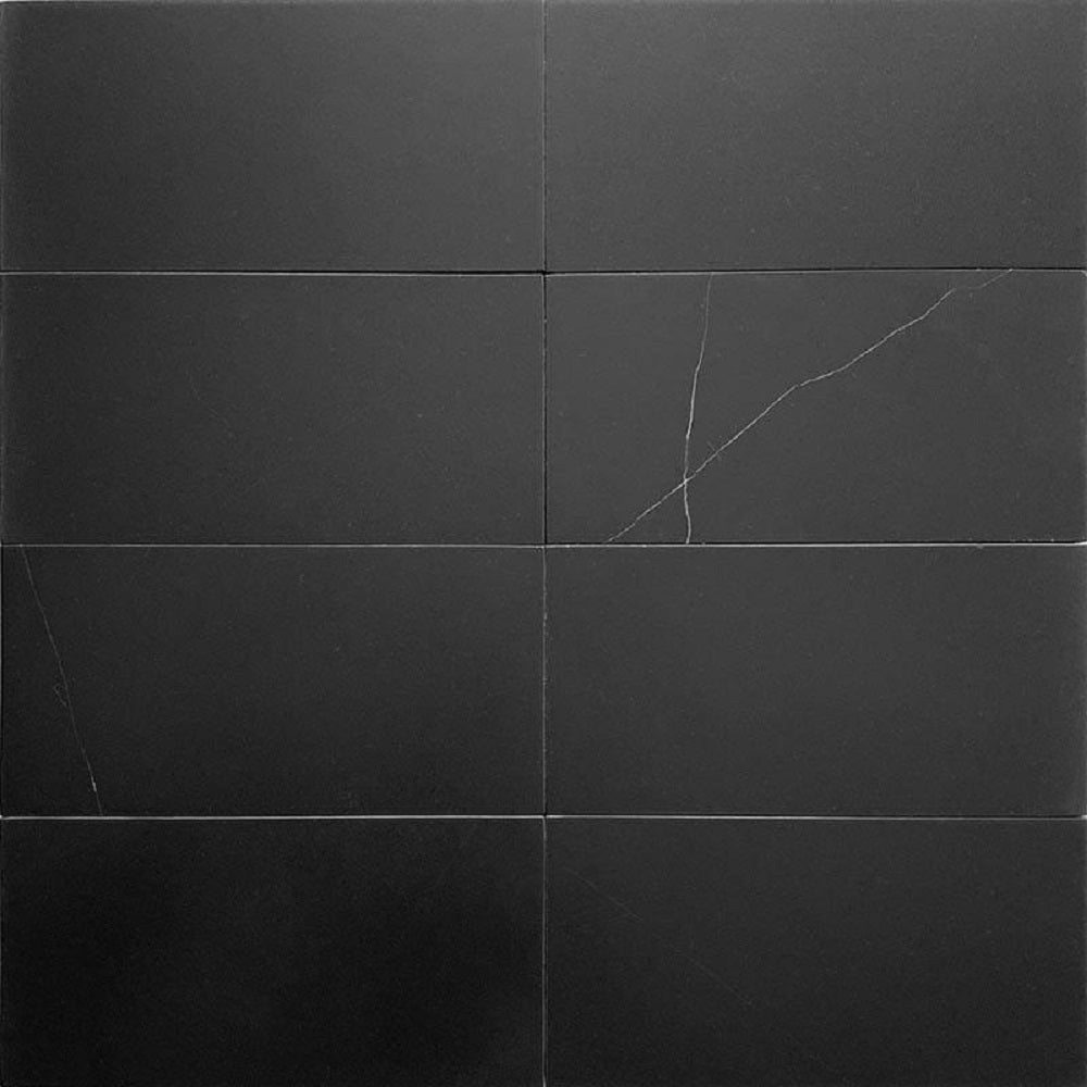 Eastern Black 3x6 honed honed marble subway tile with subtle white veining in a brick pattern