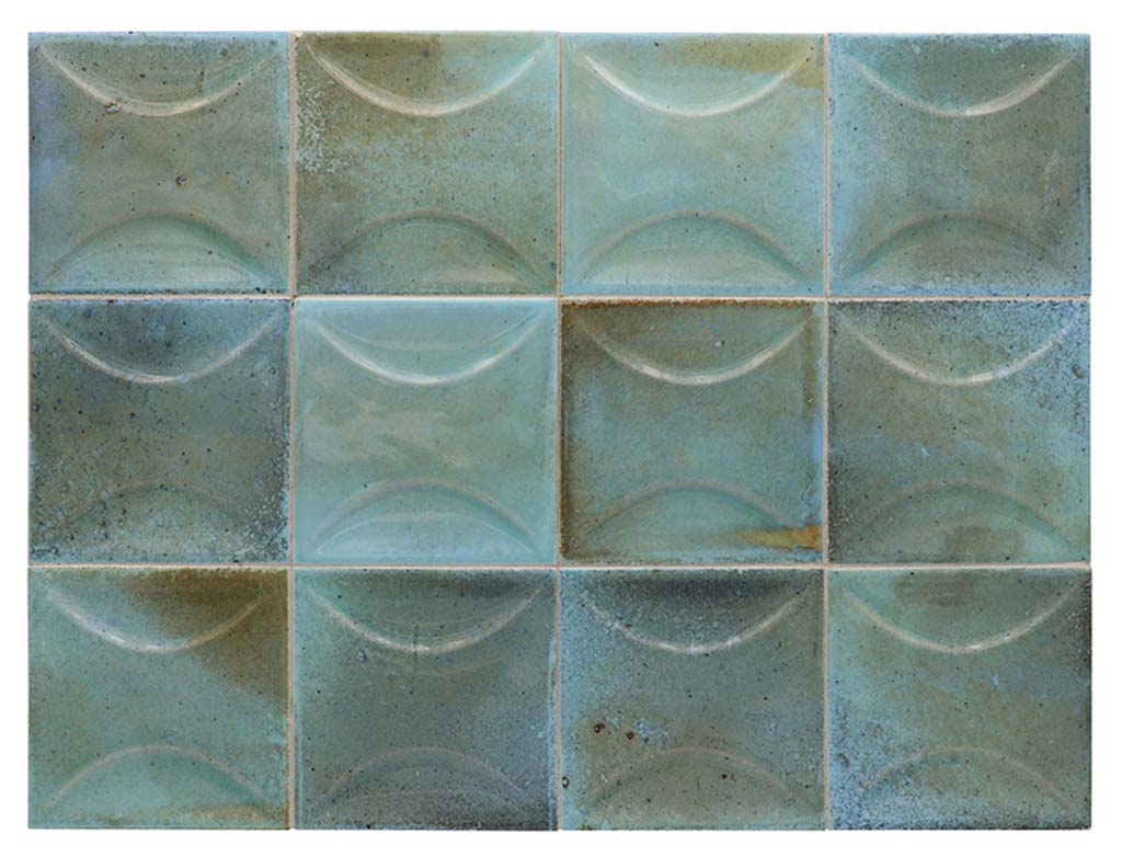 blue 4x4 glossy ceramic subway deco tile with raised concave design in varying blue shades