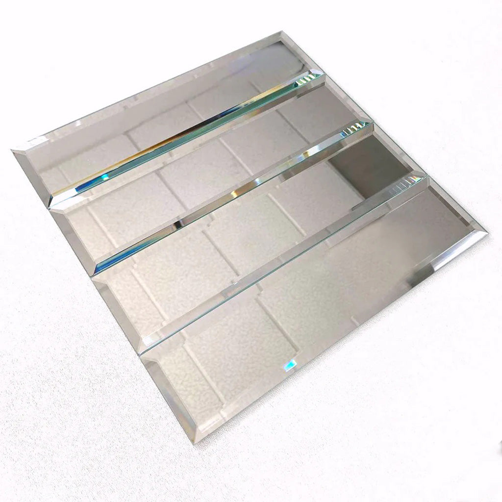 Clear polished glass subway tile in 3x12 size with beveled edges for sleek wall design