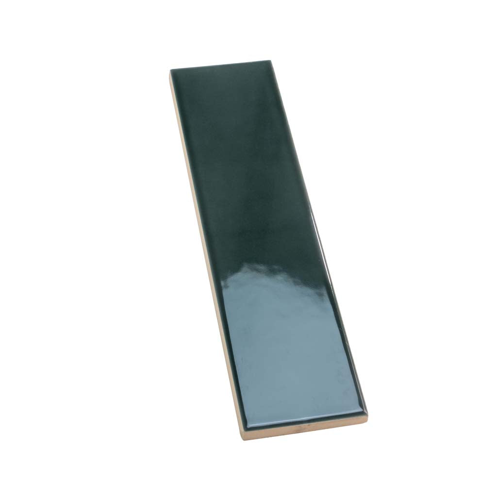 Glossy green ceramic subway tile measuring 2 by 8 inches with smooth finish