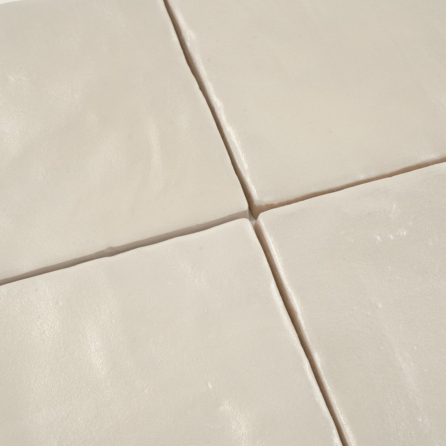 beige 4x4 ceramic square tiles with glossy and matte finish tightly aligned