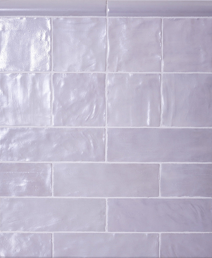 cloud gray 2.5x8 ceramic subway tiles with glossy and matte finish in staggered layout