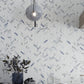 White with Blue-Gray 11 x 12 Polished Porcelain Herringbone Tile