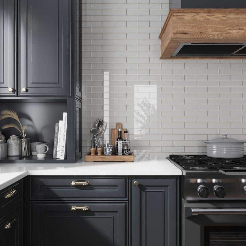 warm greige glossy glass subway tile 3x12 installed in modern kitchen backsplash