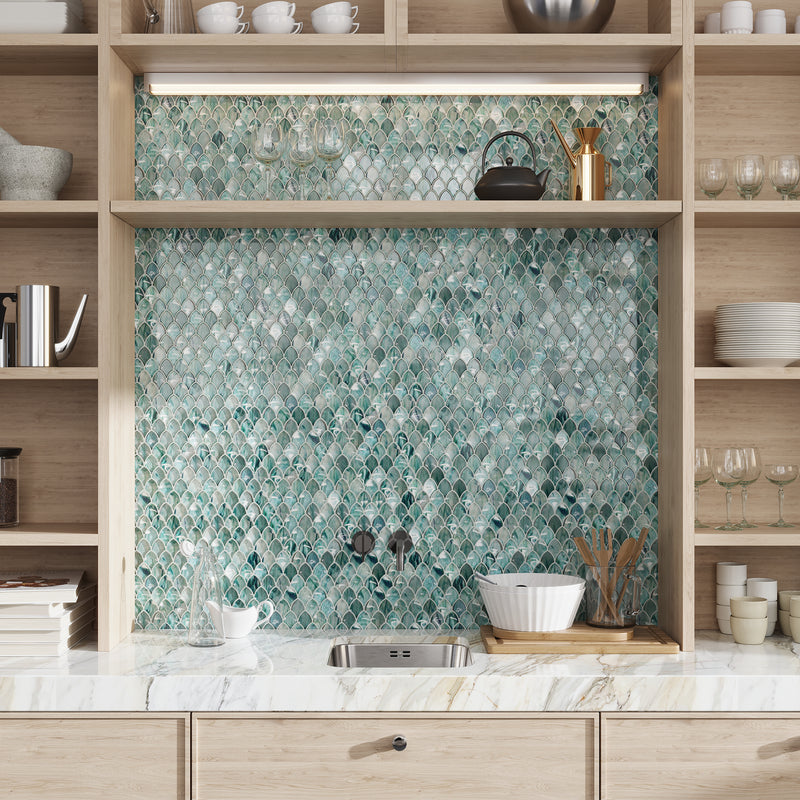 sea blue 11x11 glossy glass mosaic tile in teardrop pattern with varied blue tones and white grout