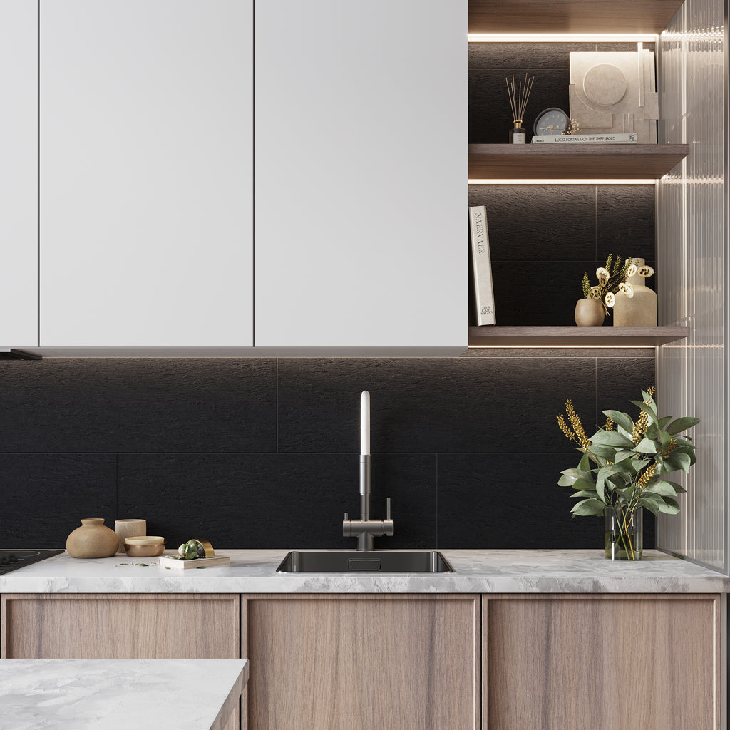 black matte ceramic large tile 12x36 inches installed as kitchen backsplash