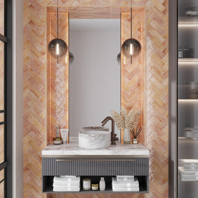 glossy pink 2.5x8 ceramic subway tile in herringbone pattern on bathroom wall