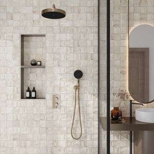 white ceramic glossy small square tiles with curved geometric patterns on shower wall