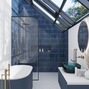 dark blue glossy ceramic subway tiles 2.5x8 installed vertically in bathroom shower area